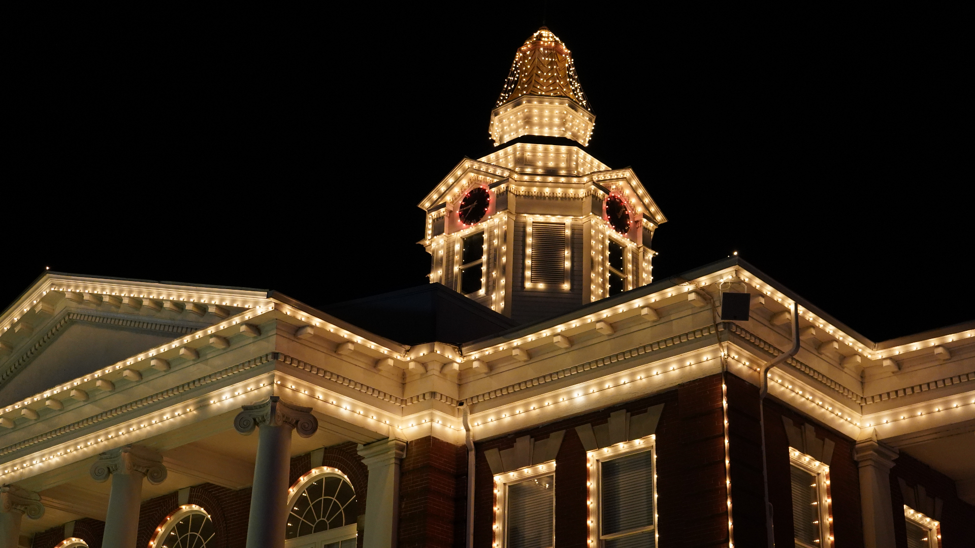 Historic courthouse lit up at night
